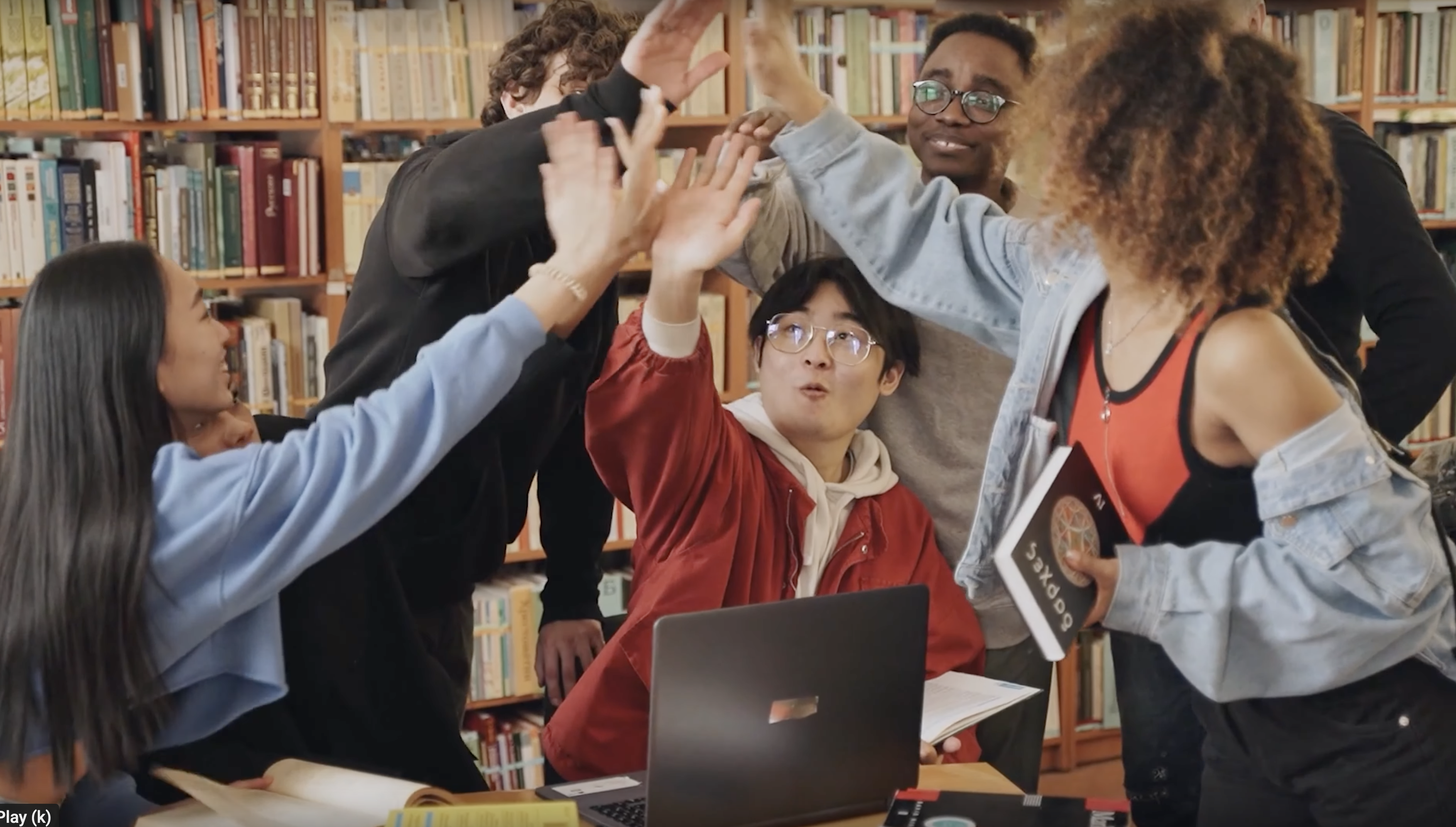 Students high five